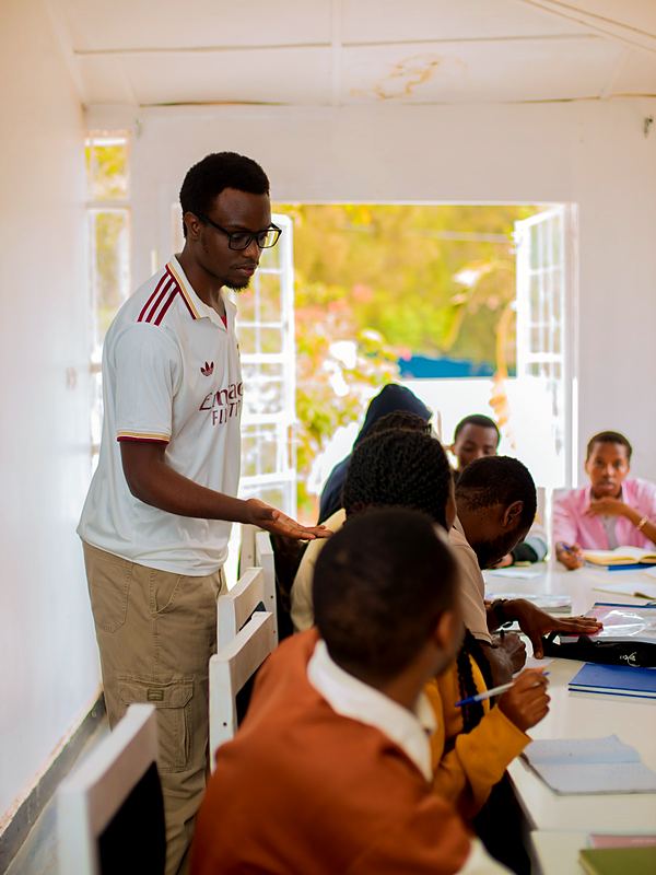 An instructor helping students with their work